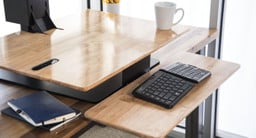 A tiered tray drops the keyboard into your lap for optimal ergonomics while seated (Natural Rubberwood surface shown)