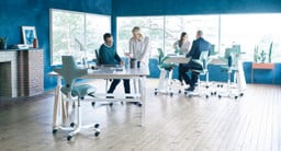 The Capisco Chair (left) offers comfort and loads of color options—and plays well with its cousin, the Capisco Puls (right)