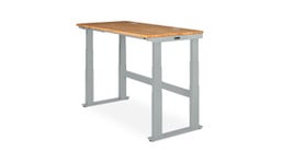 The UPLIFT V2-Commercial 4-Leg Frame in gray with a rubberwood desktop