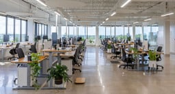  Bamboo UPLIFT Standing Desks in a Dual Sided Row Configuration with Bamboo Rocker-X Board