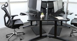 Three 120° curved office desks in pod formation