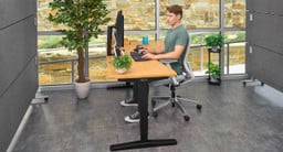 The desktop's curved cutout improves reach and eliminates the "dead space" found in the far corners of rectangular desktops