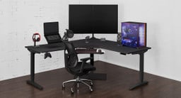 60" x 60" x 30" Black Laminate L-Shaped Gaming Desk in Seated Position