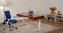 The Narrative Standing Desk is a handmade, solid wood desk with built-in drawers