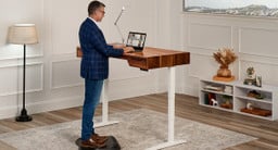 Rear view of a 60" x 30" Rustic Walnut Solid Wood UPLIFT Narrative Standing Desk