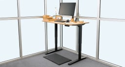 Gray UPLIFT V2 Standing Desk C-Frame with 27.5” feet with our 60" x 30" carbonized bamboo desktop.