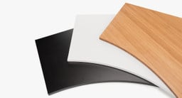 From left to right: black GREENGUARD laminate, white GREENGUARD laminate, and bamboo