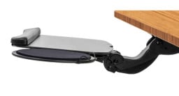 Adjust the tray to have negative tilt and maintain straight wrists while typing