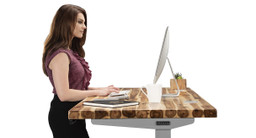 60" x 30" Acacia Solid Wood desktop  on a gray UPLIFT V2 Standing Desk Frame