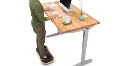 60" x 30" Ash Solid Wood desktop on a gray UPLIFT V2 Standing Desk Frame