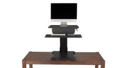 The standing desk converter comes with included palm rest